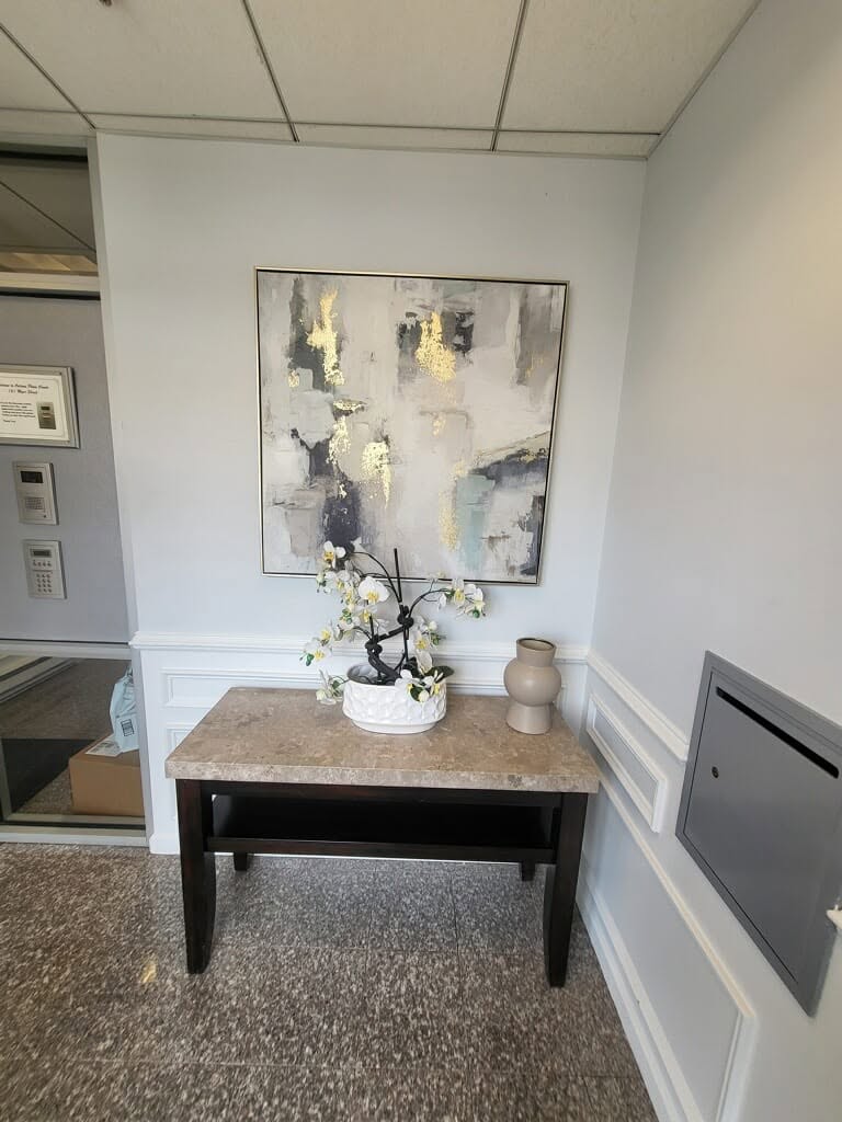 Interior entry with painted walls, trim, and a console table